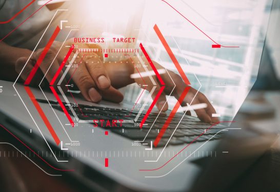 business man hand working on laptop computer on wooden desk as concept, young man student typing on computer sitting at wooden table